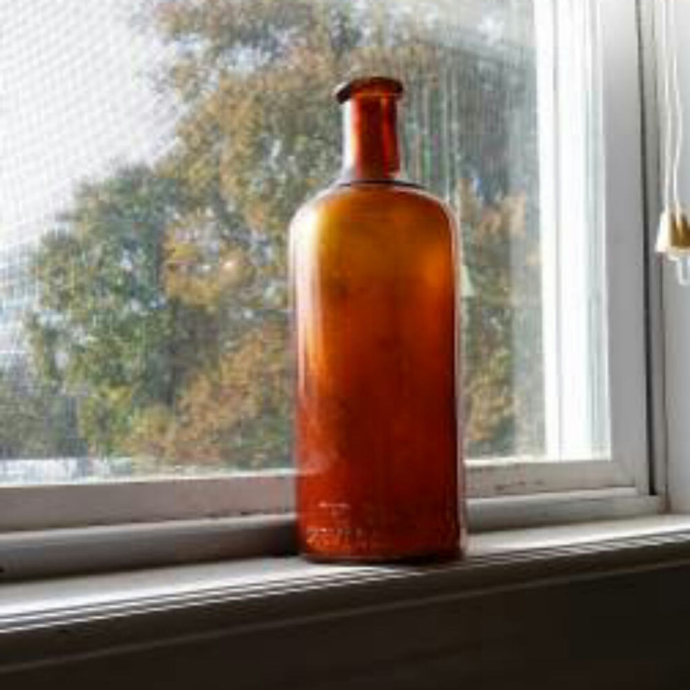 Antique glass pharmaceutical bottle